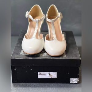 Brinley Co. T-Strap Chunky Heel Round Toe Matte Pumps White